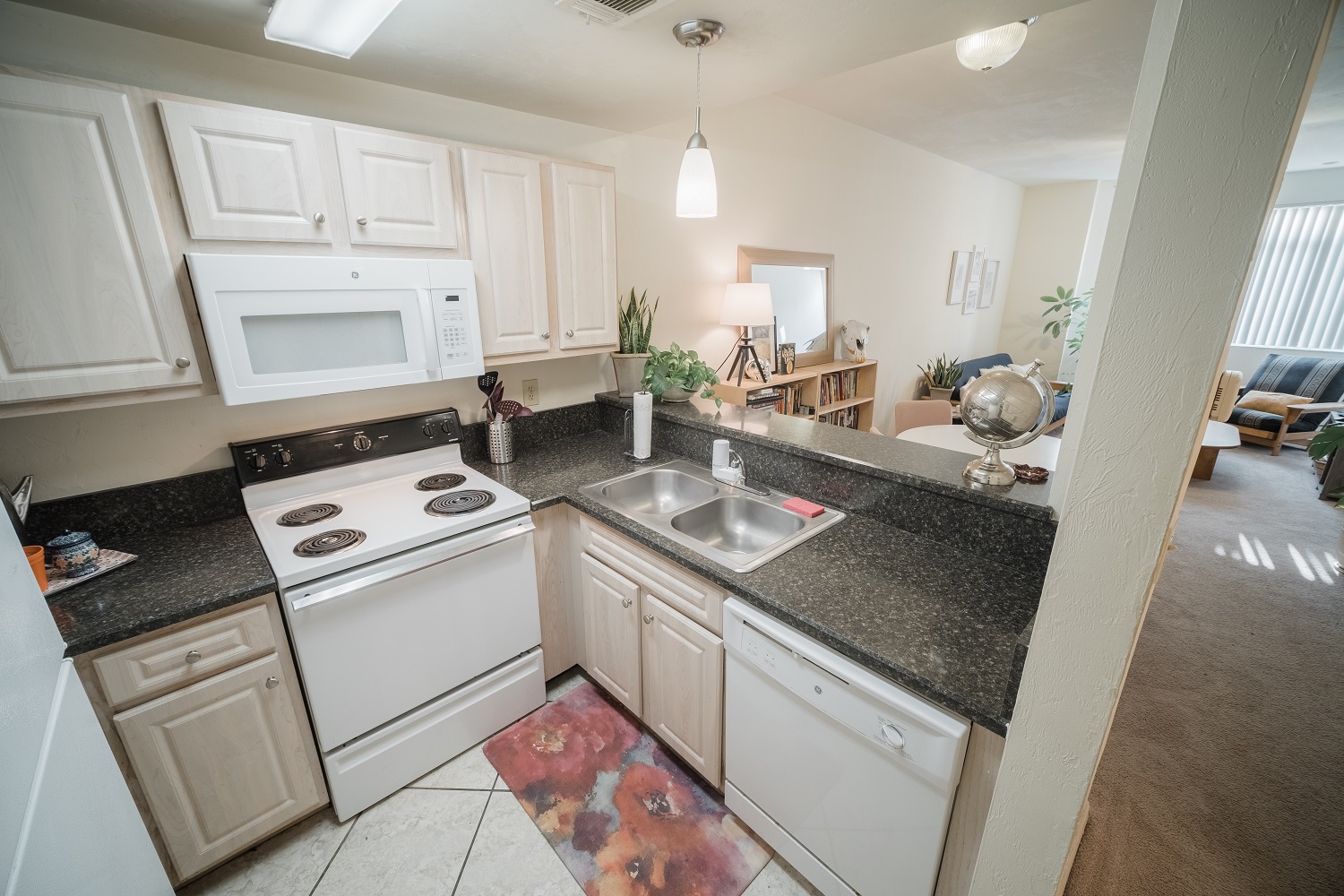 This floorplan has been upgraded with oversized tile floors, granite style countertops, soft-touch drawers, new cabinetry, appliances, fixtures and more!
