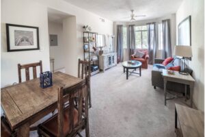 Living/dining room with large bay window