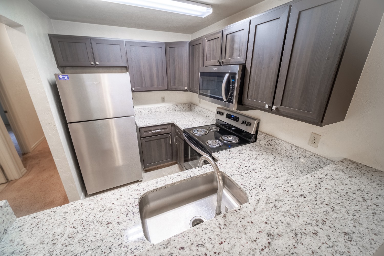 3 Bedroom kitchen with granite countertops and stainless steel appliances